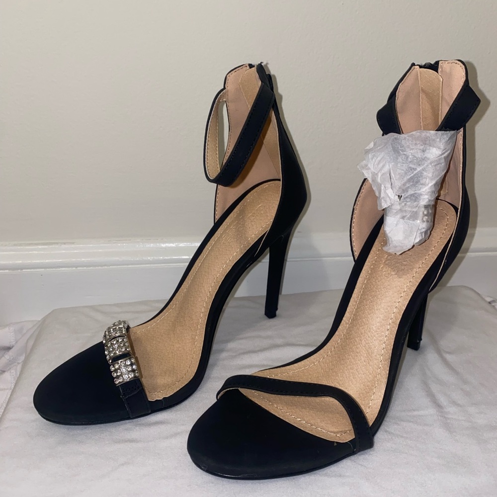 Never worn black heels with silver embellishment